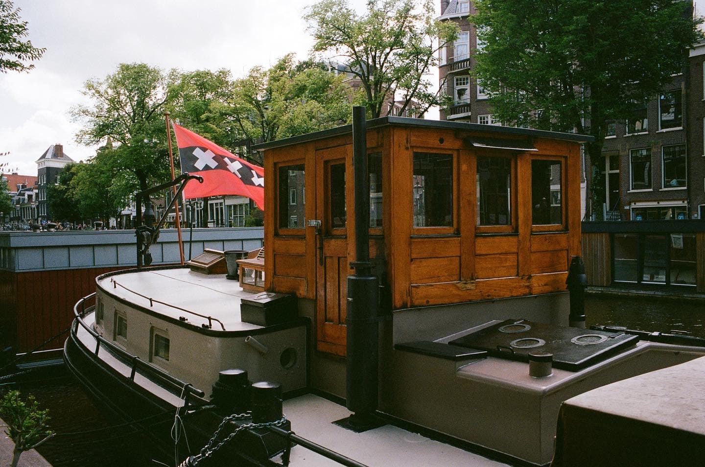 a boathouse with a xxx flag in amesterdam