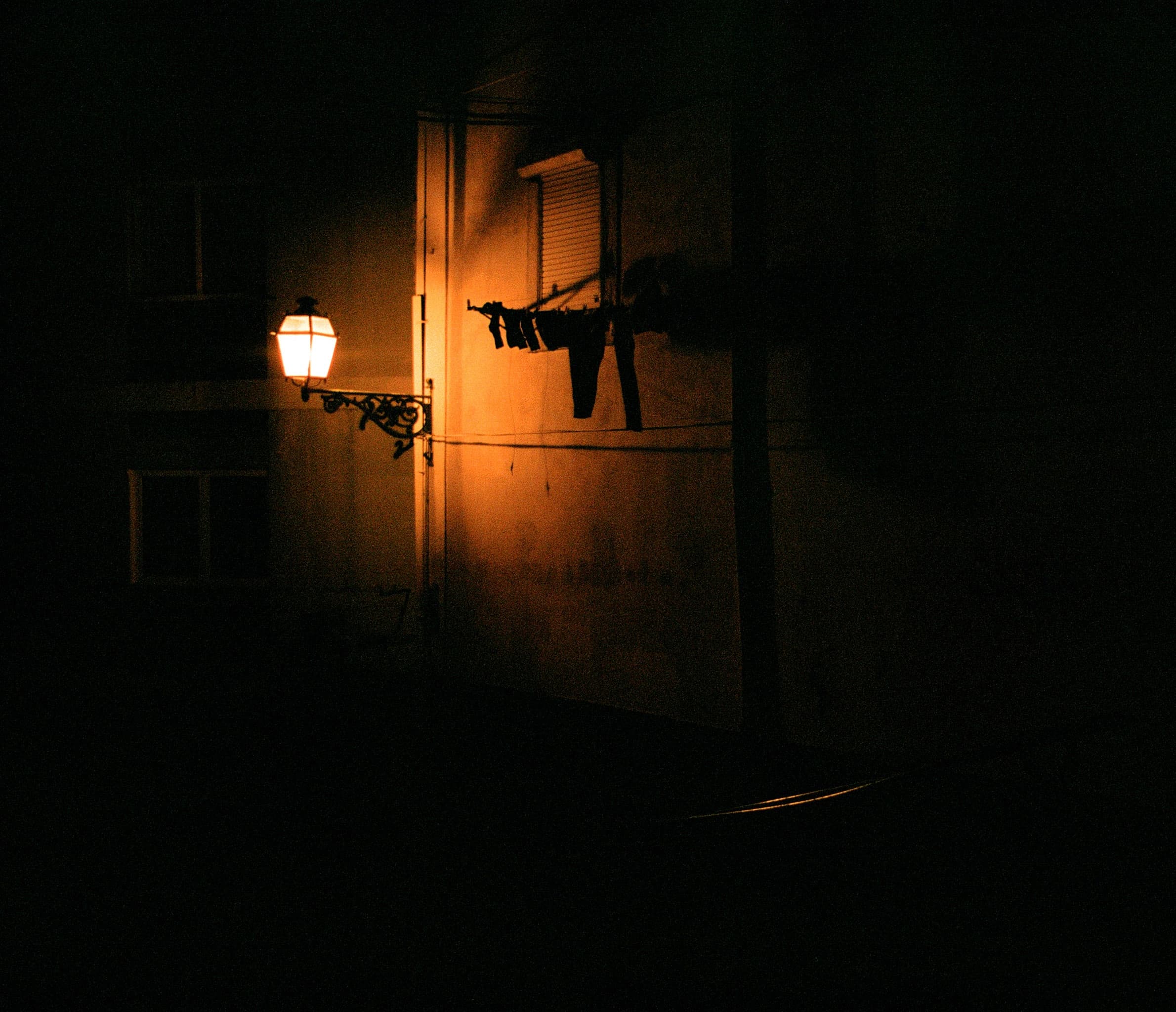 a street lamp at night in lisbon