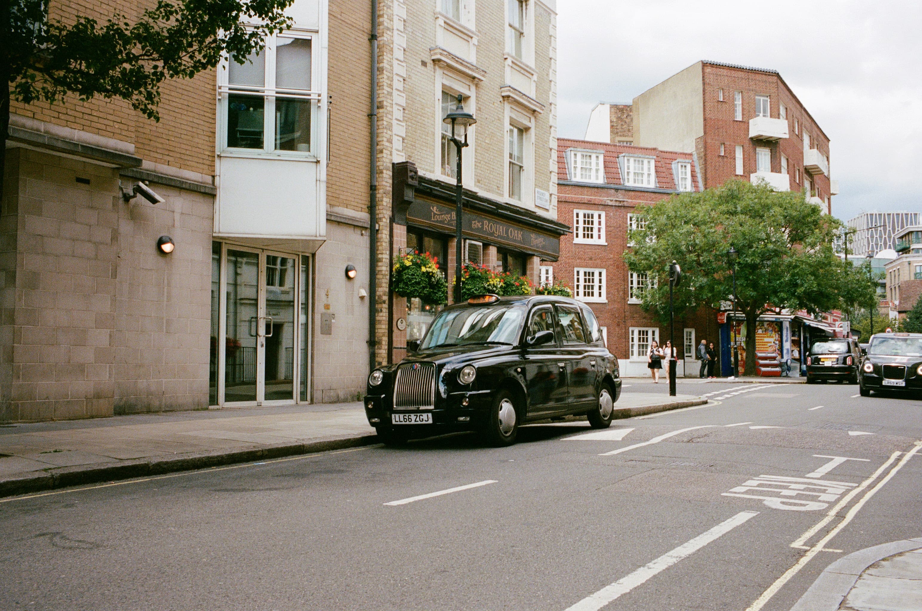 a taxi parked on the street of london